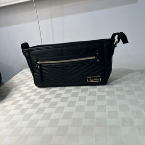 Itzy Ritzy Black Quilted Crossbody Baby Bag with Gold Hardware